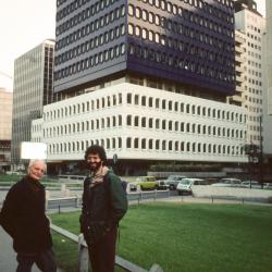 Ivan Wyschnegradsky and Charles Amirkhanian standing in front of modern building, Paris (1976)