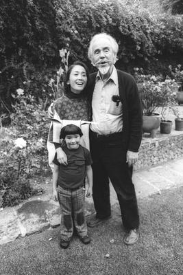 Conlon Nancarrow with wife Yoko and son Mako, full length portrait, facing forward, Mexico City, (1977)