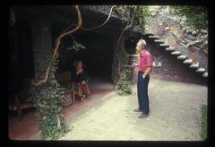 Carol Law, seated, and Conlon Nancarrow, standing outside his home in Mexico City, 1969