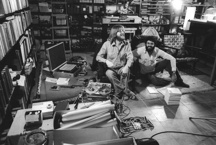 Robert Shumaker and Charles Amirkhanian, full length portrait, sitting, in Nancarrow’s studio, Mexico City, (1977)