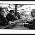 Several artists from the 1st Other Minds Festival seated at the outdoor dining table at the Djerassi Resident Artists Program, Woodside, CA (1993)