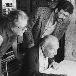 Gladys Nordenstrom, and Charles Amirkhanian, both standing, with Ernst Krenek, seated in Krenek's home studio (1985)