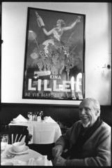 Conlon Nancarrow, half length portrait, seated, facing slightly left, in restaurant, (1993)
