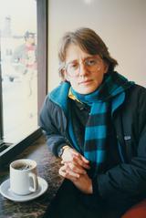 Half length portrait of Janice Giteck, seated, having coffee, 1988