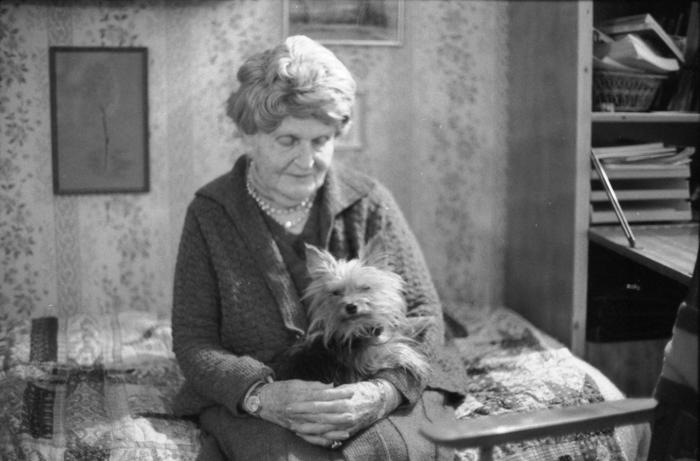 Germaine Tailleferre with dog, seated, Paris France, 1973