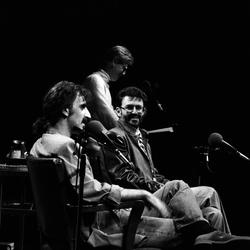 Frank Zappa talks as Charles Amirkhanian listens during an appearance at the Palace of Fine Arts Theater, San Francisco, May 20, 1984