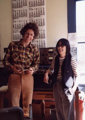 Ron Erickson & Susan Ohori, three quarter length portrait, standing, facing forward, Berkeley CA, 1977