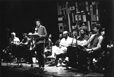 Participating composers of the 1990 Composer-to-Composer Festival on stage, with Laurie Anderson reading aloud their manifesto on censorship, Telluride, CO.