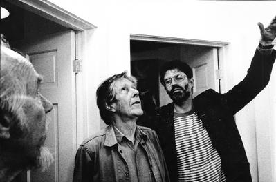 Half length portrait of Charles Amirkhanian gesturing to John Cage, with profile of Conlon Nancarrow looking on, Telluride, CO. (1989)