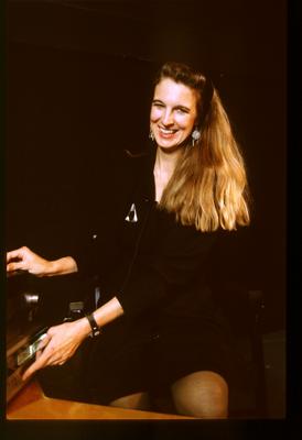 Three quarter length portrait of Susan Stone onstage facing forward during Speaking of Music at the Exploratorium, v2. 2 (1991)