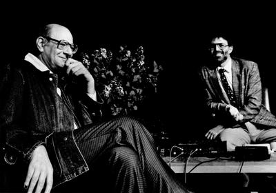 Mauricio Kagel seated onstage with Charles Amirkhanian during Speaking of Music, San Francisco (1988)