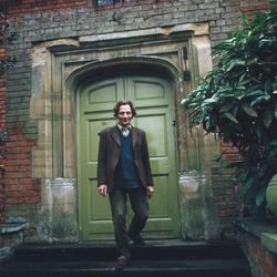 Full Length portrait of Henri Chopin on the steps outside his home in Ingatestone (1972)