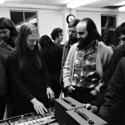 Tom Zahuranec talks with a participant, at a KPFA Radio Event, Mills College, Oakland CA, 1971