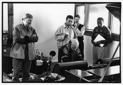 Terry Riley, Alvin Singleton, Charles Amirkhanian, and Muhal Richard Abrams watching Rex Lawson play the pianola, (1995)