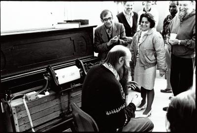 Rex Lawson during a discussion about the pianola while other composers observe, standing, Woodside CA, (1995)
