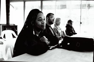 Pamela Z looking on with Hafez Modirzadeh and others in the background, Djerassi Resident Artists Program, Woodside, CA (1997)