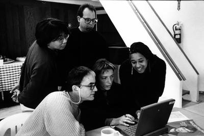 Several OM 4 artists gathered around a laptop during the Djerassi Resident Artists Program in Woodside, CA (1997) 