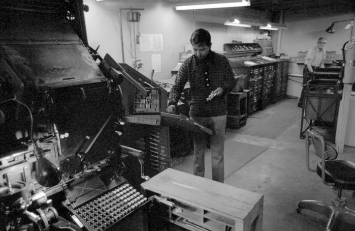 Ceasar Villanueva and Walter Ellis in a work room of the Ellis Rubber Stamp Co., 1973