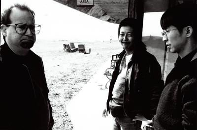 Carl Stone, Sei Kazama, and Katsuyuki Takahashi standing outside in Woodside, CA (1997)