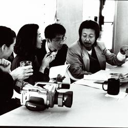 Half length portrait of Hatsune Ohtsu, Katsuyuki Takahashi, and Sei Kazama in discussion at the Djerassi Resident Artists Program, Woodside, CA (1997)