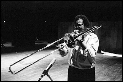 George Lewis, three quarter length portrait, standing, facing slightly left, playing the trombone, San Francisco CA, (1996)