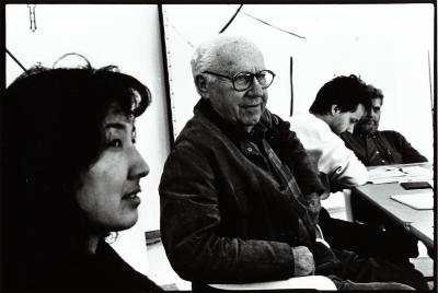 Head and shoulders portrait of Miya Masaoka, David Raksin and others at a table, Woodside 1996 (cropped image)
