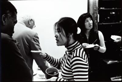 Head and shoulders portrait of Kui Dong talking to Olly Wilson, Woodside, CA (1996)