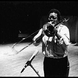 George Lewis, three quarter length portrait, standing, facing forward, playing the trombone, San Francisco CA, (1996)