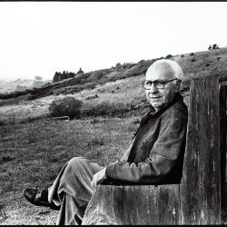 David Raksin, full length portrait, seated, head turned to camera, Woodside, 1996 (cropped image)