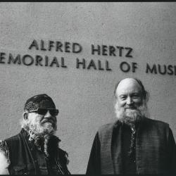 LaMonte Young and Terry Riley, half length portrait outside Hertz Hall in Berkeley, CA (1996)