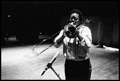 George Lewis, three quarter length portrait, standing, facing forward, playing the trombone, San Francisco CA, (1996)