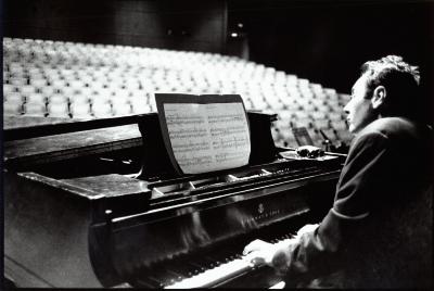 Ionel Petroï, half length portrait, seen over the left shoulder, playing the piano, San Francisco, 1996 (cropped image)