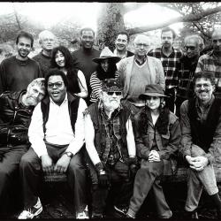 Featured composers and organizers of OM 3, standing and seated, facing forward, Woodside, 1996 (cropped image)