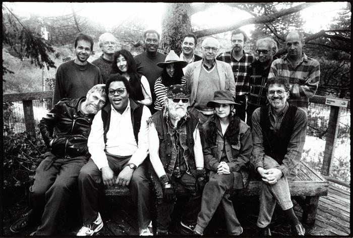 Featured composers and organizers of OM 3, standing and seated, facing forward, Woodside, 1996 (cropped image)