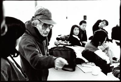 Half length portrait of Henry Brant gesturing to unidentified woman, Djerassi Resident Artists Program, Woodside, CA (1997)