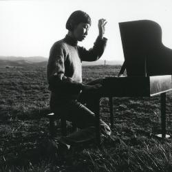 Margaret Leng Tan, full length portrait, facing right, playing toy piano, Woodside CA, (1999)