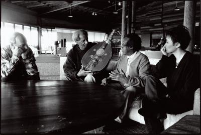 Christian Wolff and Leroy Jenkins, holding a oud,  looking right, with Hamza El Din and Hyo-shin Na, looking left, half length portrait, seated, Woodside CA, (2000)