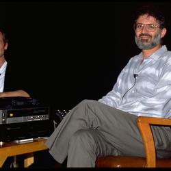 John Oswald and Charles Amirkhanian seated onstage at the Exploratorium, San Francisco (1990)