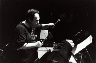 William Winant, half length portrait, playing percussion, facing right, San Francisco (cropped image)