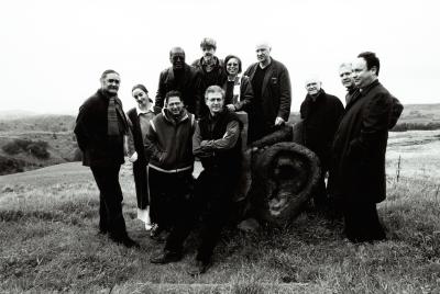 Featured composers and organizers of OM 7, full length portrait, facing forward, Woodside, 2001 (cropped image)