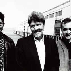 Marc Sabat, James Tenney, & Stephen Clarke, head and shoulders portrait, standing, facing forward, 2001 (cropped image)