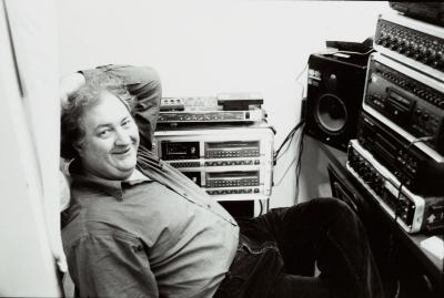 Three quarter length portrait of David Josephson, seated, facing camera, San Francisco, 2001 (cropped image)