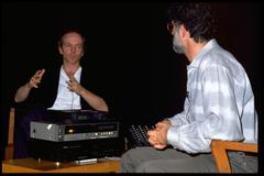 John Oswald and Charles Amirkhanian in discussion onstage at the Exploratorium, San Francisco (1990)