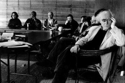 Featured OM 10 composers, half length portrait, seated at table, listening, Woodside, 2004