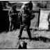 Fred Frith at ground level in a site sculpture, with Michael Nyman, Daniel Bernard Roumain, and Billy Bang, standing above, Woodside, CA (2005)