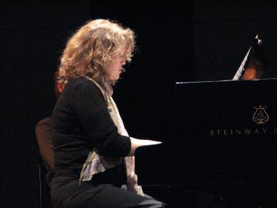 Lisa Moore, half length portrait, seated, facing right, playing the piano, San Francisco CA., (2008)