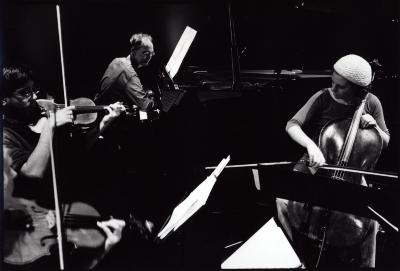 Members of the Del Sol String Quartet perform with pianist Michael Harrison, during OM 14 (cropped image)
