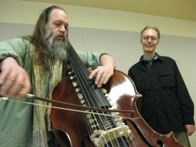 Mark Deutsch playing a modified string bass as Michael Harrison looks on, San Francisco