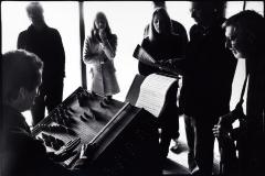 John Schneider demonstrates the Harmonic Canon for his fellow OM 14 composers (cropped image)