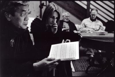 Seated (l to r), Chinary Ung, Dobromiła Jaskot, looking down at score, with Ben Johnston, & Michael Harrison, in background, looking down, Woodside CA., (2009)